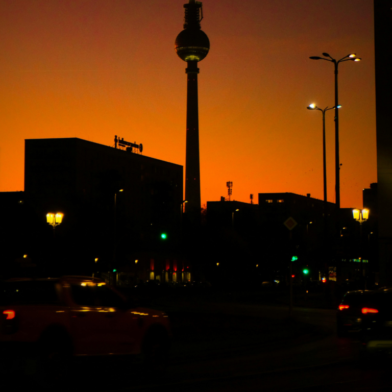 Berlin’s iconic TV tower at sunset with surrounding cityscape, reflecting digital platforms, web development, and modern tech services.